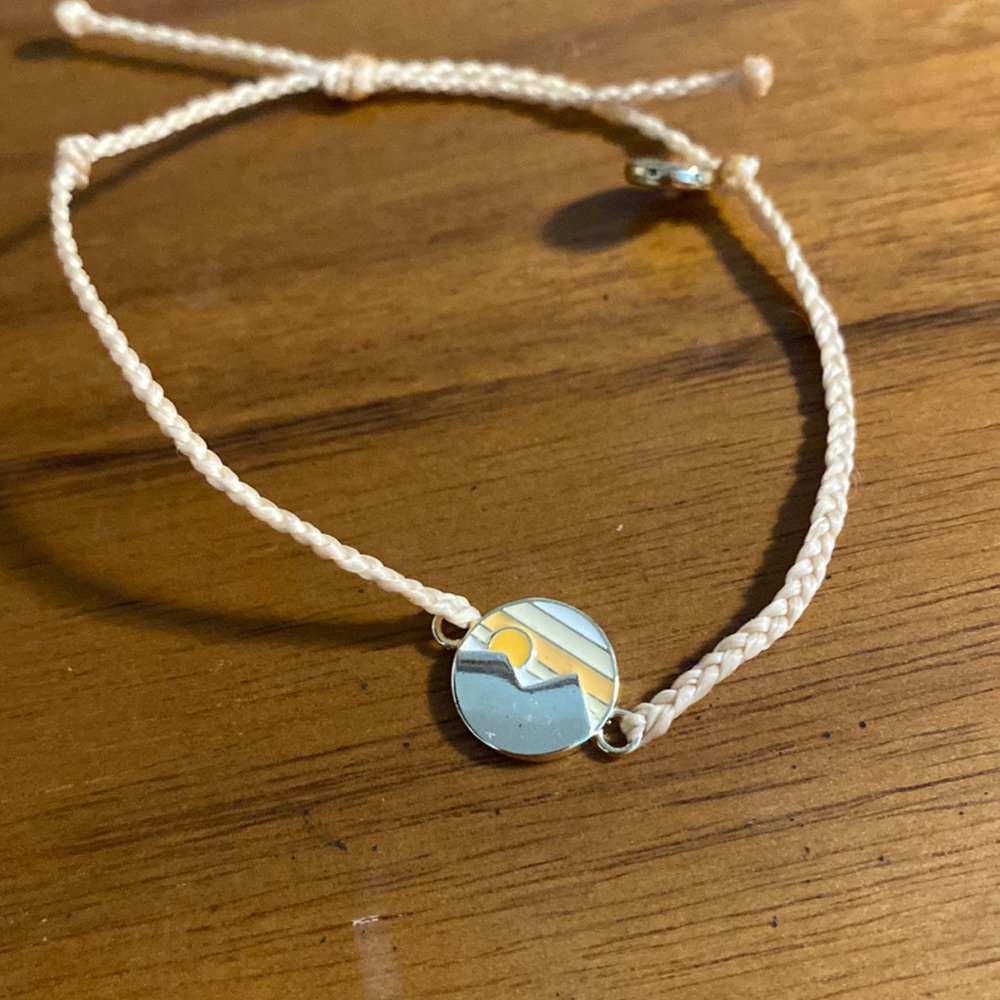 Light pink bracelet with mountain range charm
